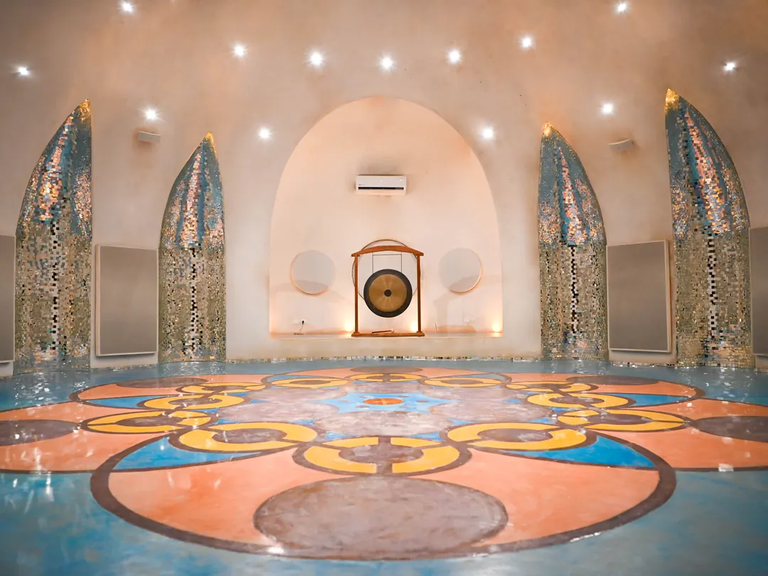 The Dome, with its gong and painted mandala floor